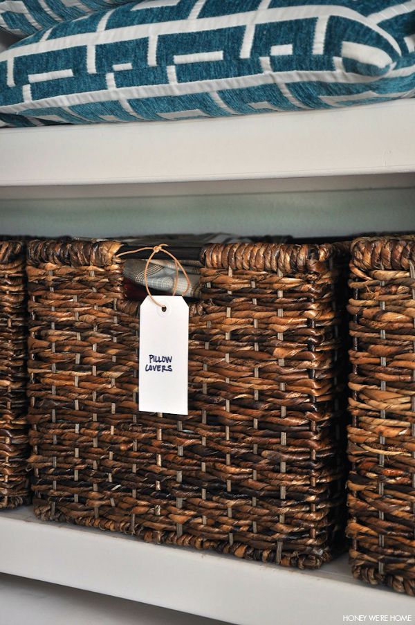Organized Linen Closet with woven bins from Target and handwritten labels | Honey We're Home