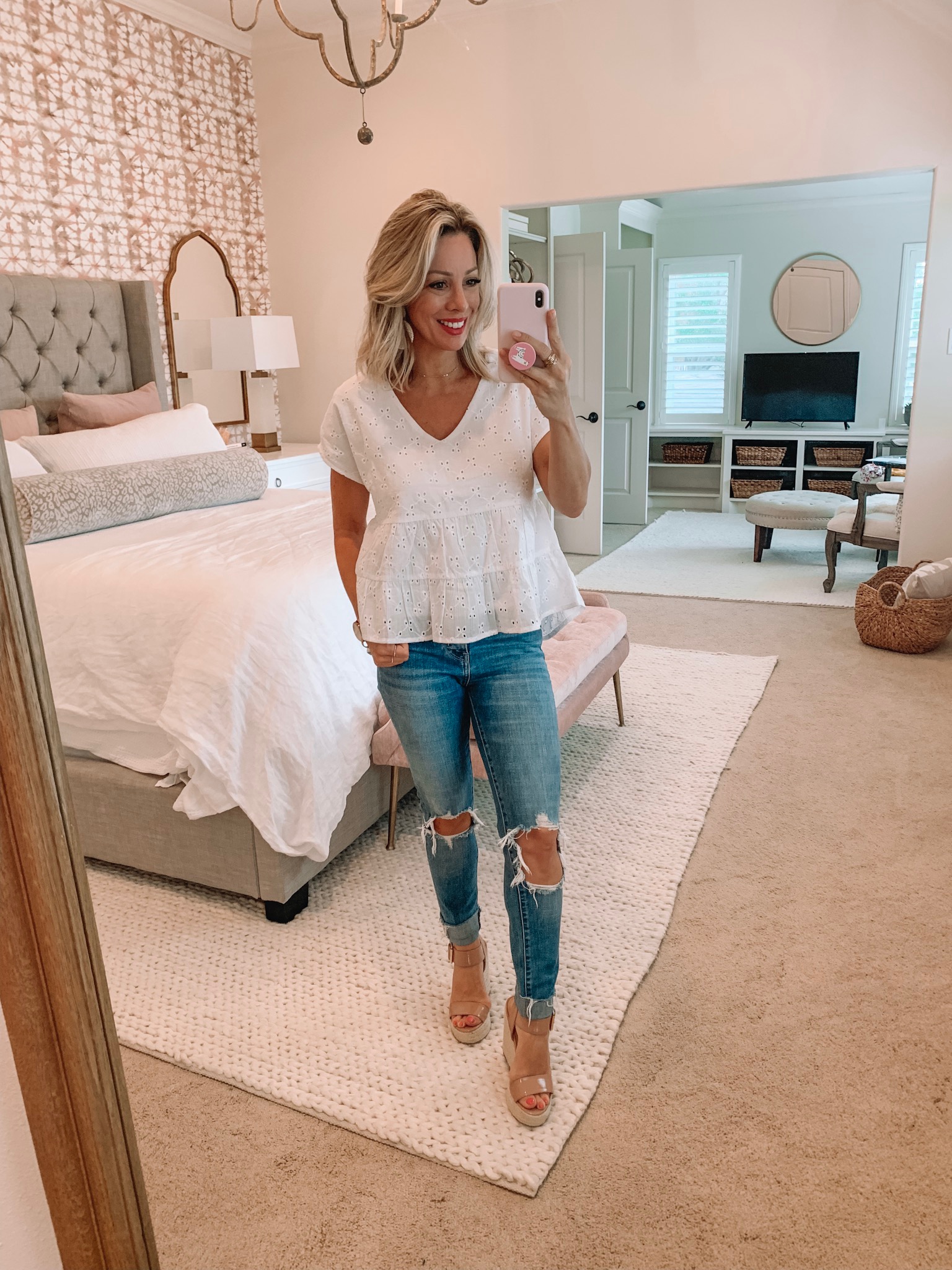 White eyelet top and ripped jeans with wedges
